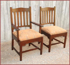 Replica Gustav Stickley early "Bungalow" dining arm chair and side chair.
